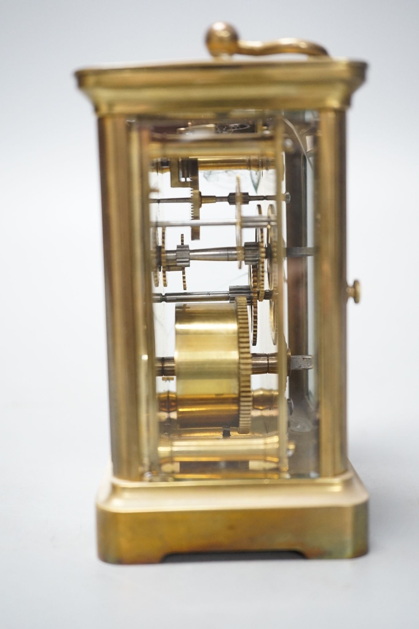 A cased brass carriage timepiece, 10.5 cms high high not including case.